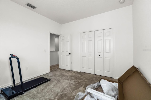 carpeted bedroom featuring a closet