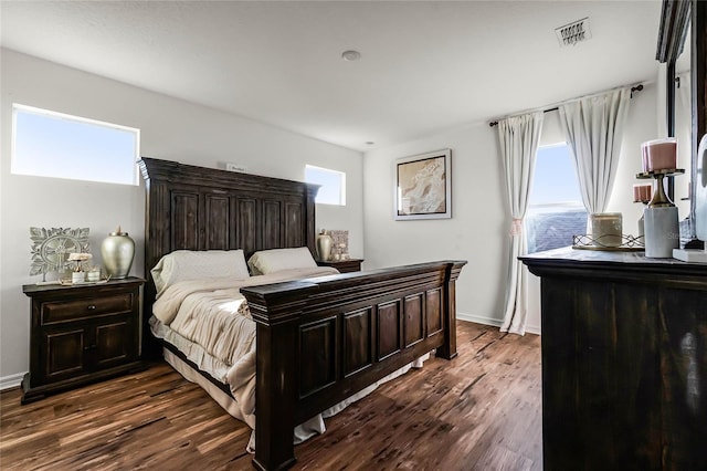 bedroom featuring dark hardwood / wood-style flooring