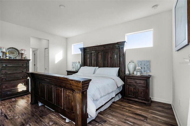 bedroom featuring dark hardwood / wood-style flooring