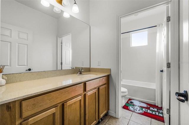 full bathroom featuring vanity, tile patterned floors, toilet, and washtub / shower combination