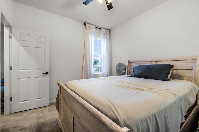 bedroom with light carpet and ceiling fan