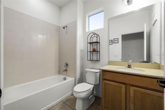 full bathroom featuring vanity, toilet, tiled shower / bath combo, and tile patterned flooring