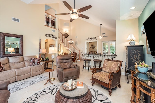 living room featuring ceiling fan, high vaulted ceiling, and light tile patterned floors