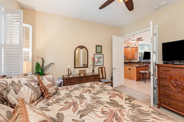 bedroom featuring light carpet and ceiling fan