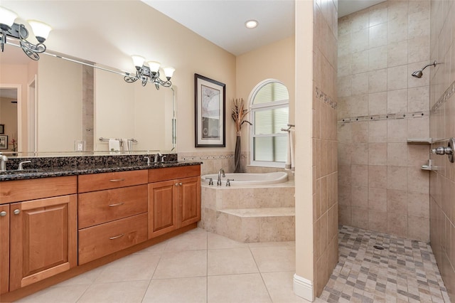 bathroom featuring vanity, a notable chandelier, tile patterned floors, and separate shower and tub