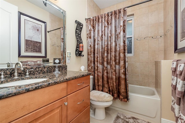 full bathroom with vanity, shower / bath combination with curtain, and toilet