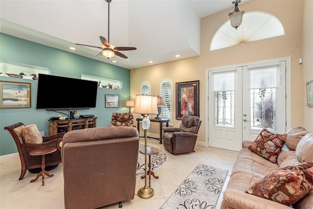 living room featuring light tile patterned floors and ceiling fan