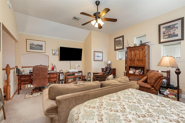 carpeted bedroom with vaulted ceiling and ceiling fan