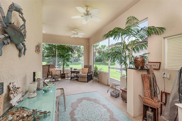 sunroom featuring ceiling fan