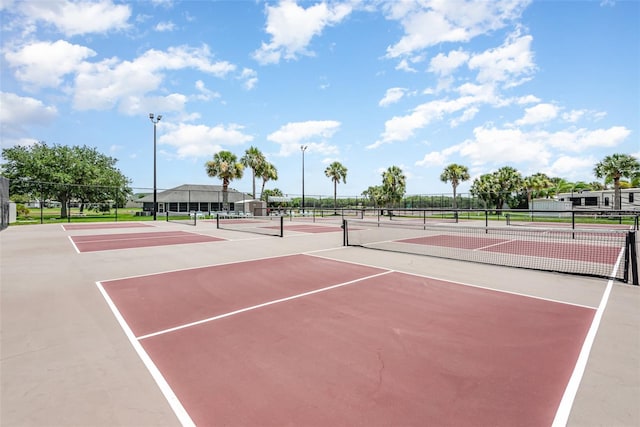 view of sport court with basketball hoop