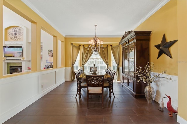 dining space featuring ornamental molding and a chandelier