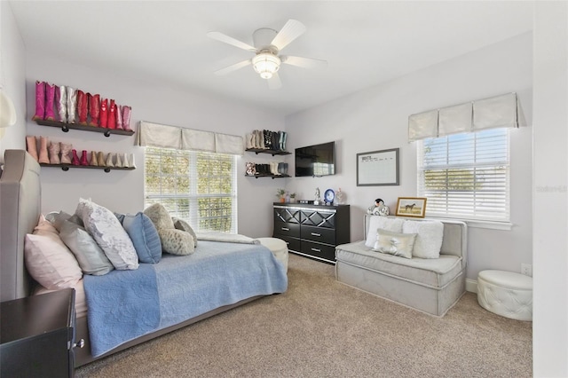 bedroom with ceiling fan and carpet floors