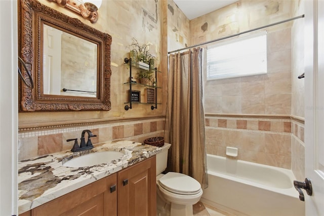 full bathroom featuring vanity, shower / bathtub combination with curtain, and toilet