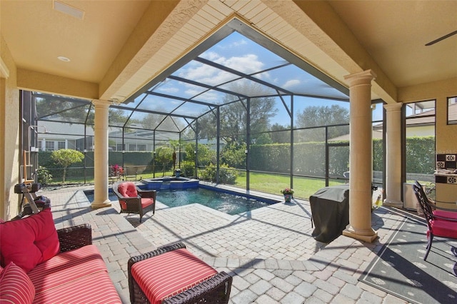 view of patio featuring outdoor lounge area, glass enclosure, and a pool with hot tub