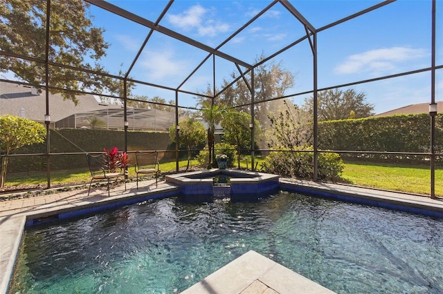 view of pool with a patio area, glass enclosure, and an in ground hot tub