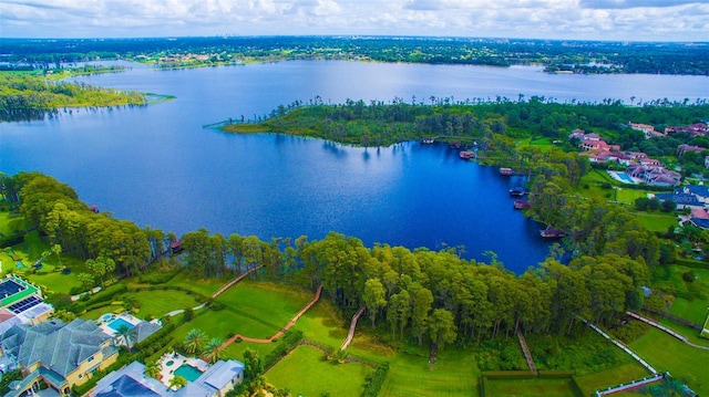 birds eye view of property with a water view