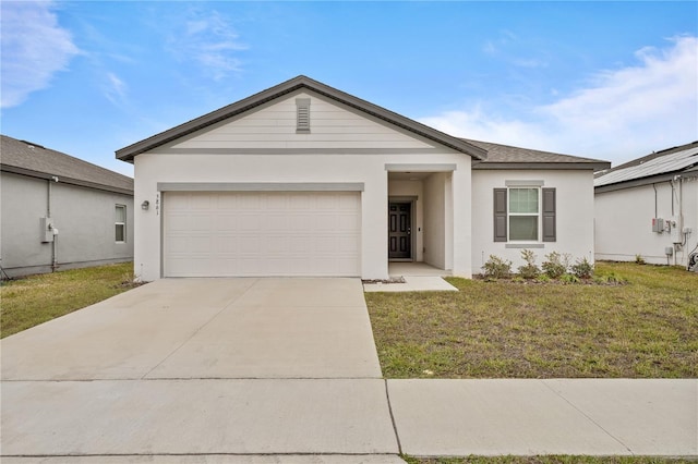 ranch-style home with a garage and a front lawn