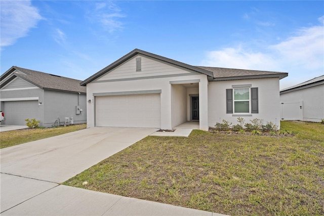 ranch-style home with a garage and a front lawn