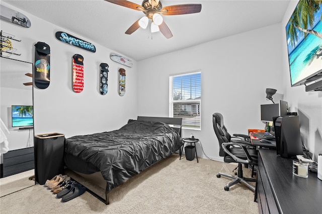 bedroom featuring light colored carpet and ceiling fan