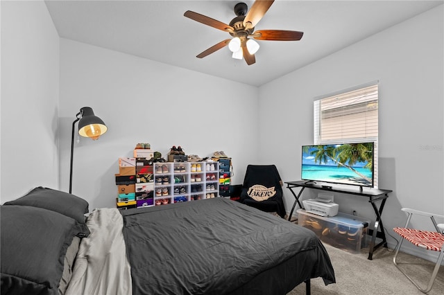 bedroom with ceiling fan and light carpet