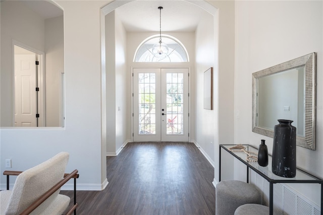 entrance foyer with french doors and dark hardwood / wood-style floors