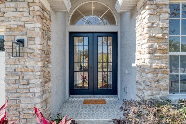 entrance to property featuring french doors