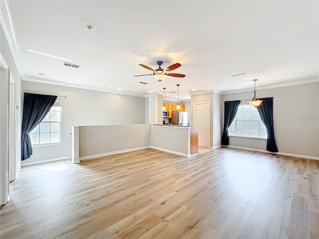 unfurnished living room with visible vents, crown molding, and light wood-style floors