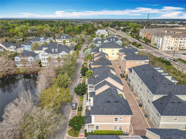 bird's eye view with a water view and a residential view