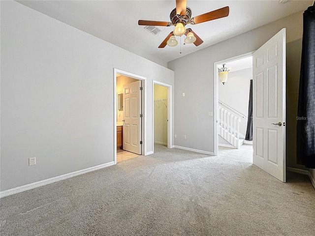 411 Old Farm Ln, Winter Springs, FL 32708 - unfurnished bedroom featuring ensuite bathroom, visible vents, light carpet, a walk in closet, and baseboards