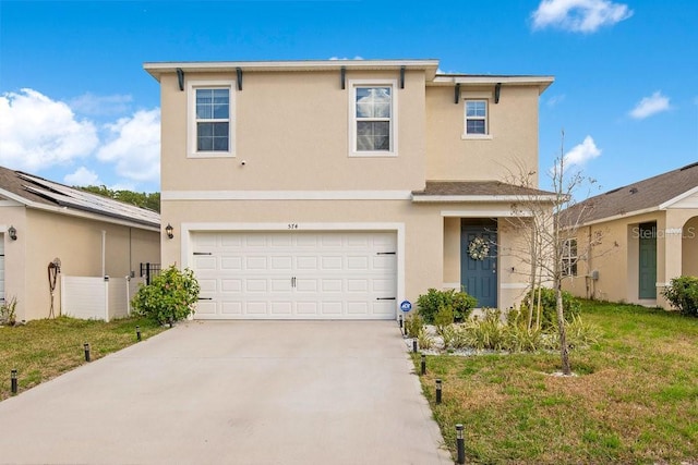 view of front of home with a garage and a front lawn