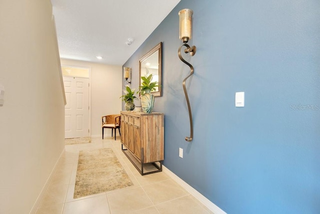 hallway featuring light tile patterned floors