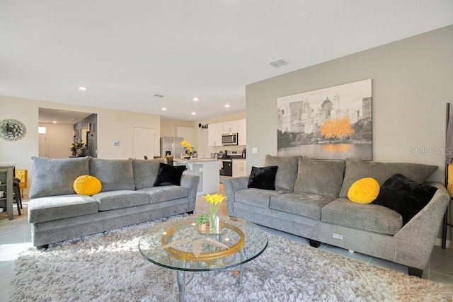 living room featuring light tile patterned flooring