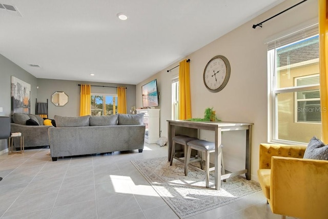 living room with light tile patterned floors