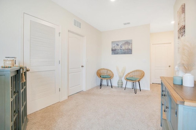 sitting room with light carpet