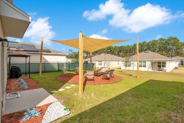 view of yard with a fire pit