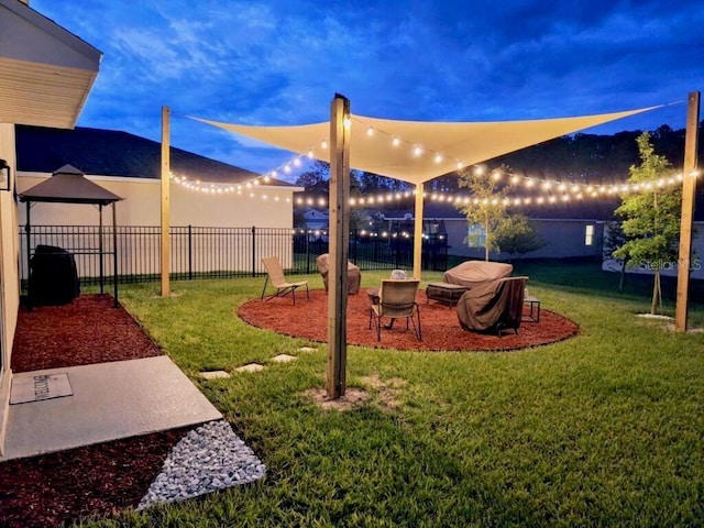 view of yard at dusk