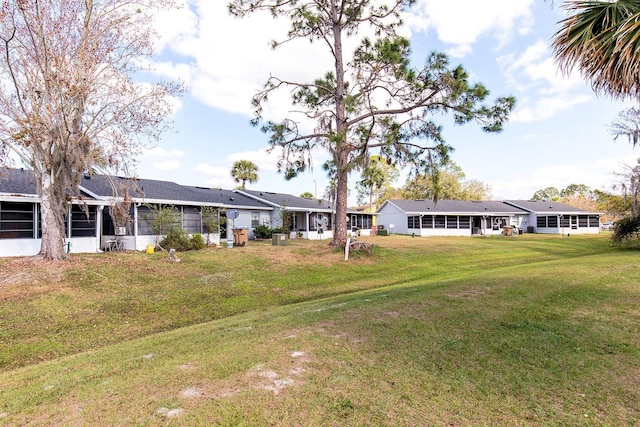 view of yard with a sunroom