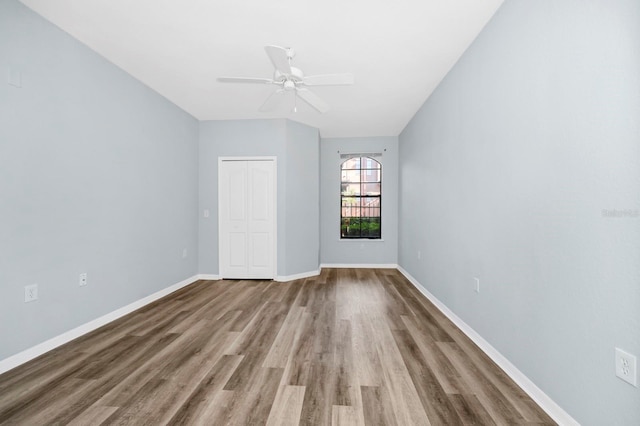 unfurnished room with hardwood / wood-style floors and ceiling fan