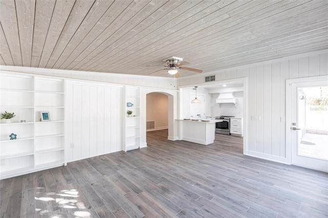 unfurnished living room with hardwood / wood-style floors, wooden ceiling, ceiling fan, and built in shelves