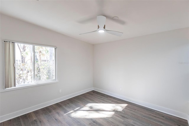 empty room featuring dark hardwood / wood-style floors and ceiling fan