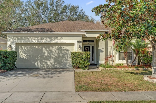 view of front of home with a garage and a front yard