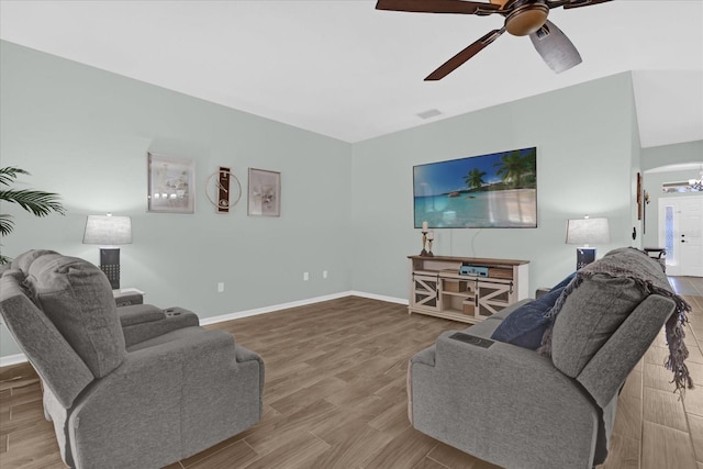 living room with ceiling fan and light wood-type flooring