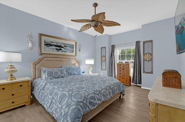 bedroom featuring ceiling fan and light hardwood / wood-style floors