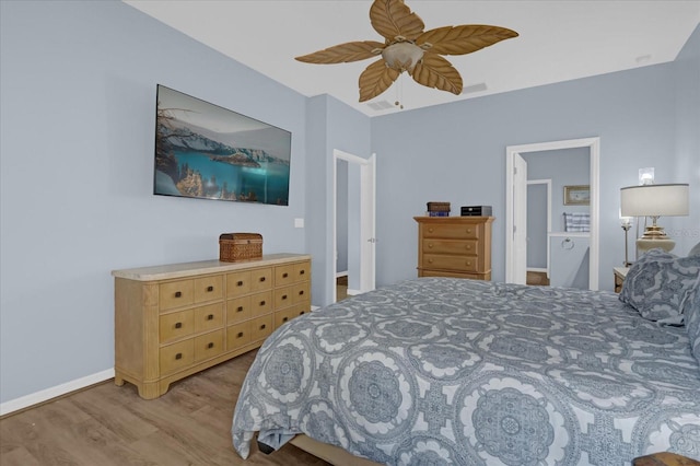 bedroom with light hardwood / wood-style floors and ceiling fan