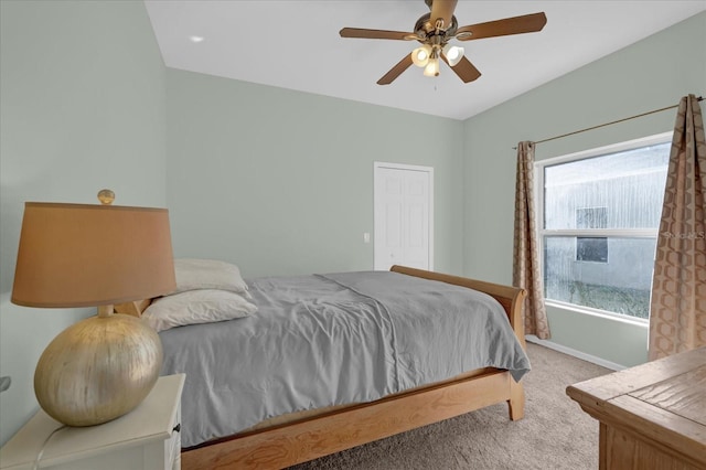 carpeted bedroom featuring ceiling fan