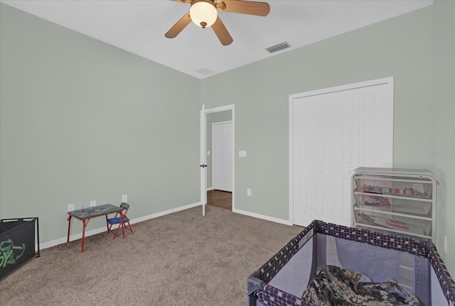 interior space featuring ceiling fan and carpet flooring