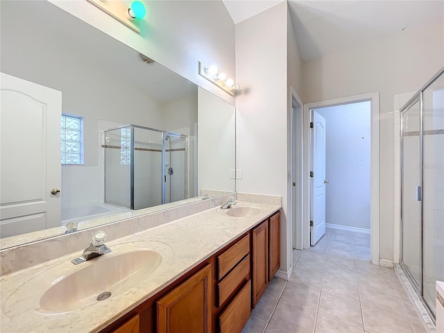 bathroom with vanity, tile patterned floors, and a shower with shower door