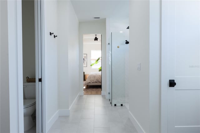 hall with light tile patterned flooring