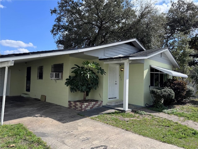 view of front of property featuring a carport