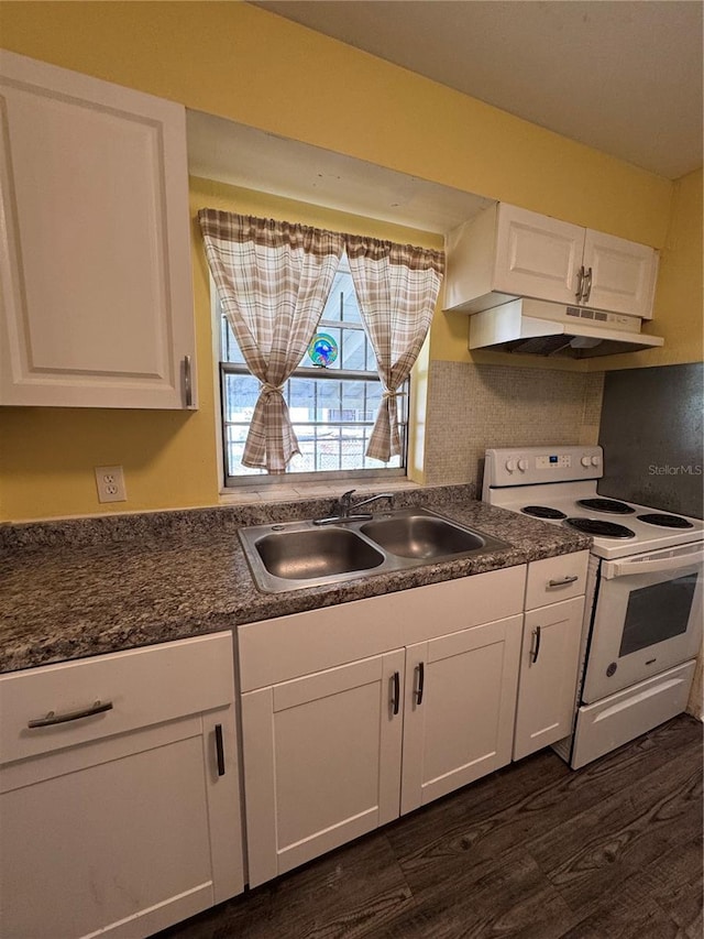 kitchen featuring dark hardwood / wood-style floors, white electric stove, white cabinetry, sink, and decorative backsplash